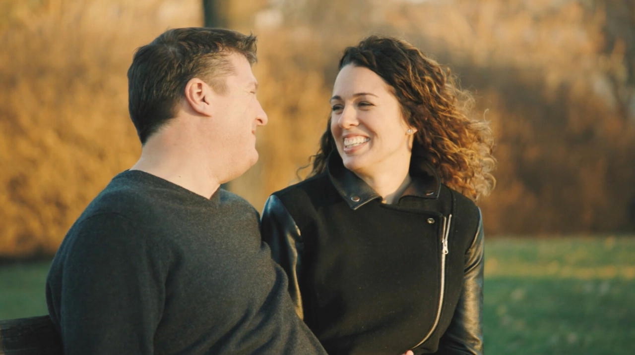 A man and woman smiling and looking into each other's eyes