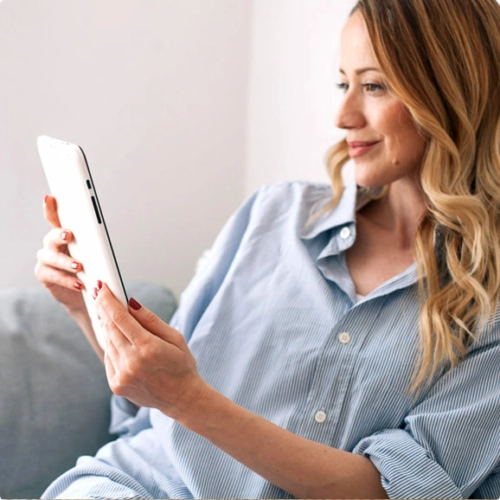 Woman on sofa with tablet