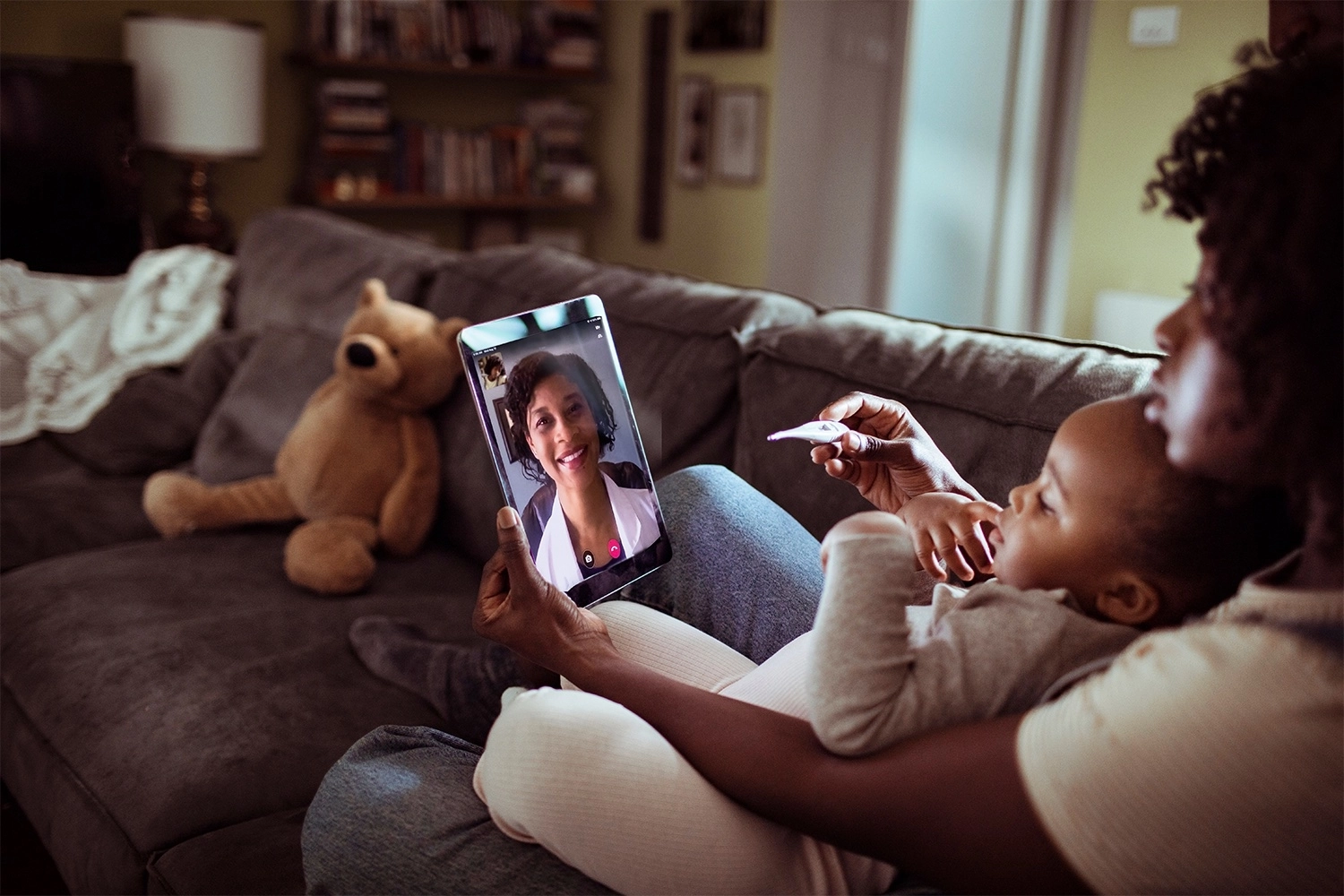 Parent and child taking an online doctor visit