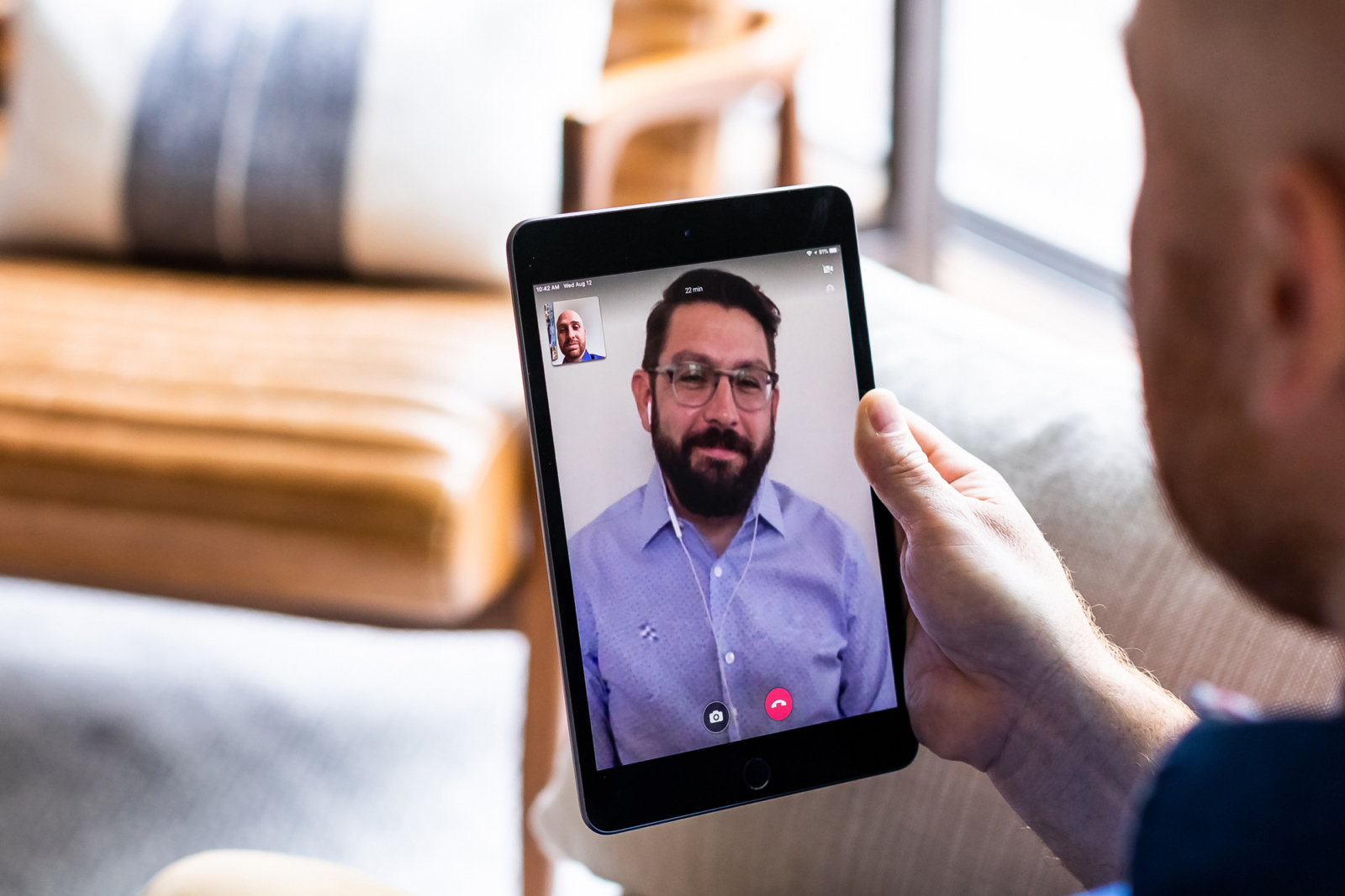 man using telehealth talking to a doctor