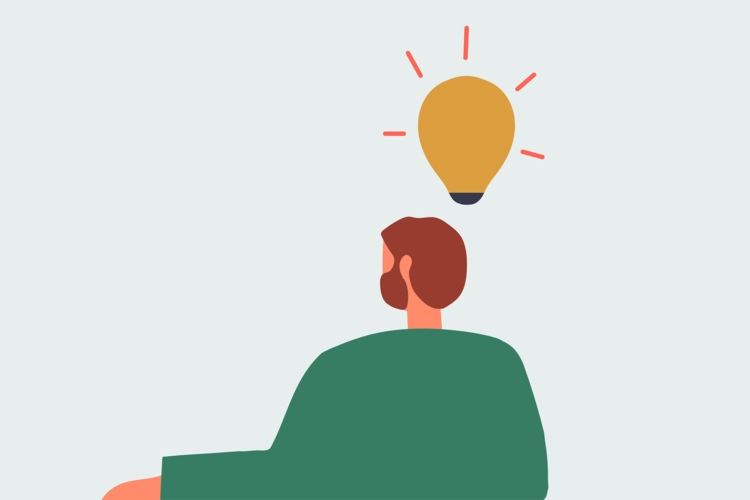 Man sitting and facing forward with a lightbulb shining over his head