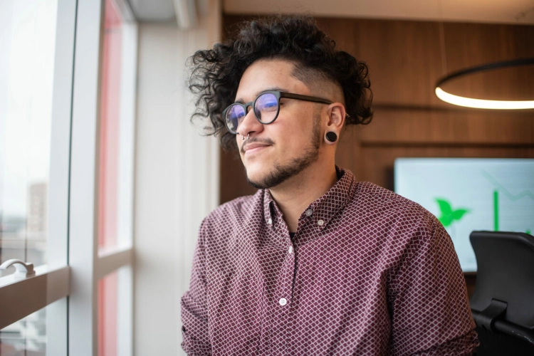 lgbtq member looking out the window