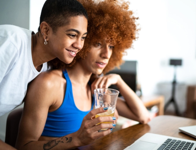 two people looking at laptop