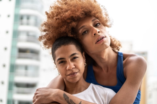 LGBTQ+ couple hugging each other