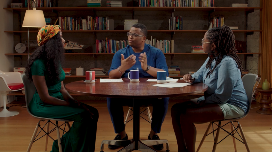 Black Health Care Coordinators at Included Health discussing their experience sitting at a table