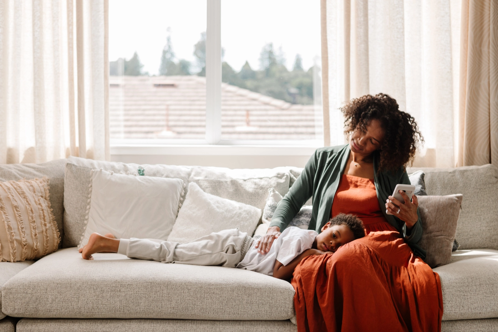mom on couch with sick child
