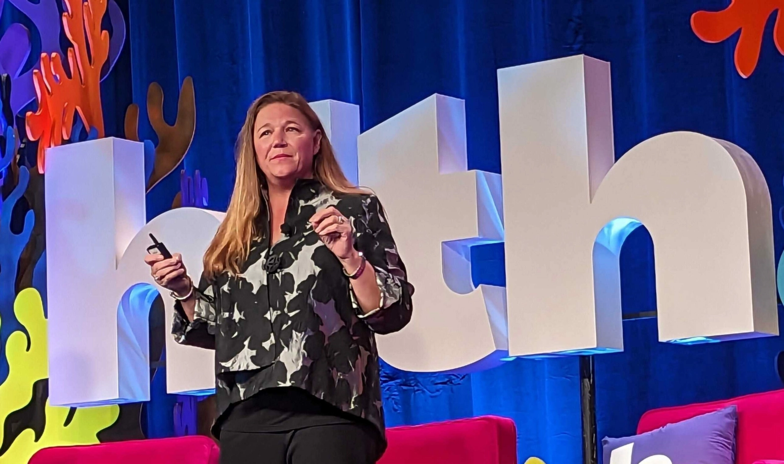 Lisa Woods Vice President of Well-being at Walmart speaks on stage about the impact of Included Health’s virtual primary care