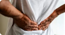 close up image of someone rubbing their back for relief