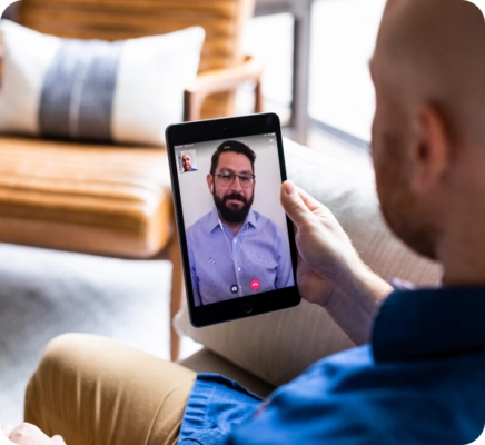 man using ipad for telehealth
