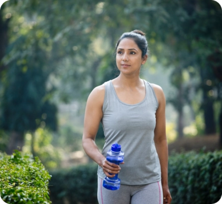 woman walking with a water bottle