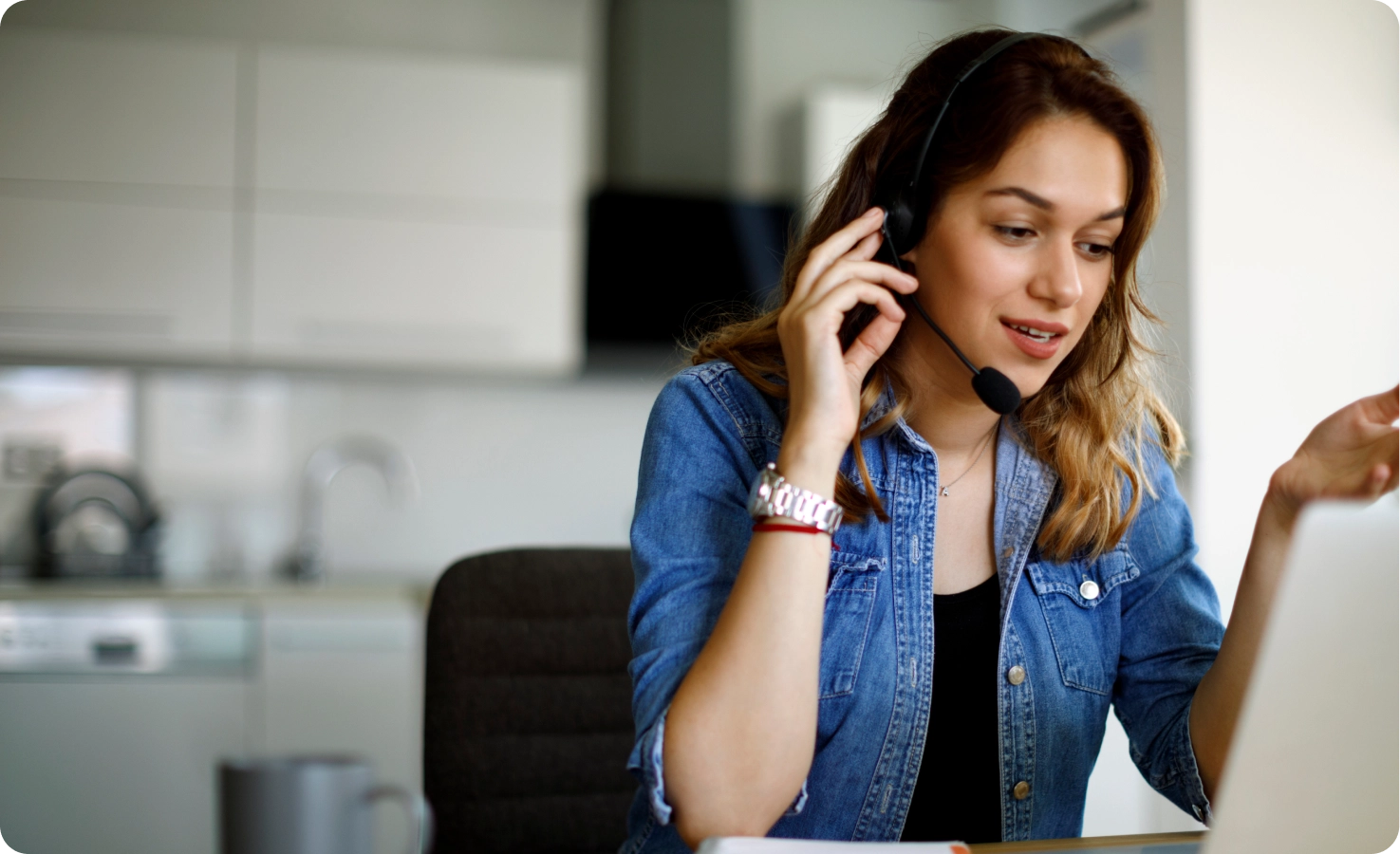 A Care Coordinator speaks with a member through a headset