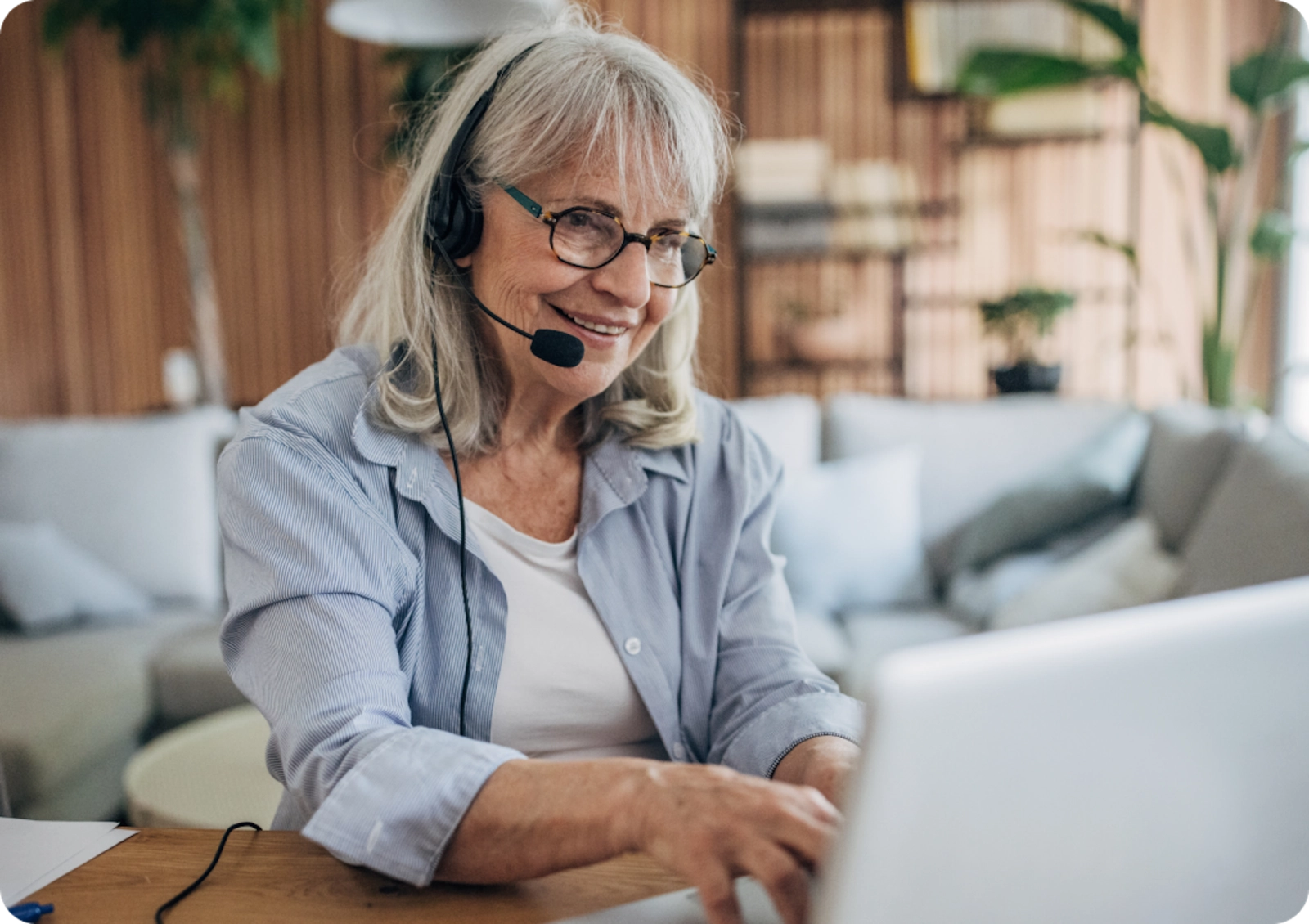 A Care Coordinator researches doctors on a behalf of a member from a home office