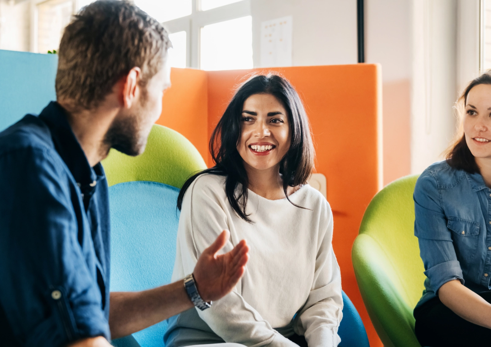 Two employers discuss ideas in an office setting
