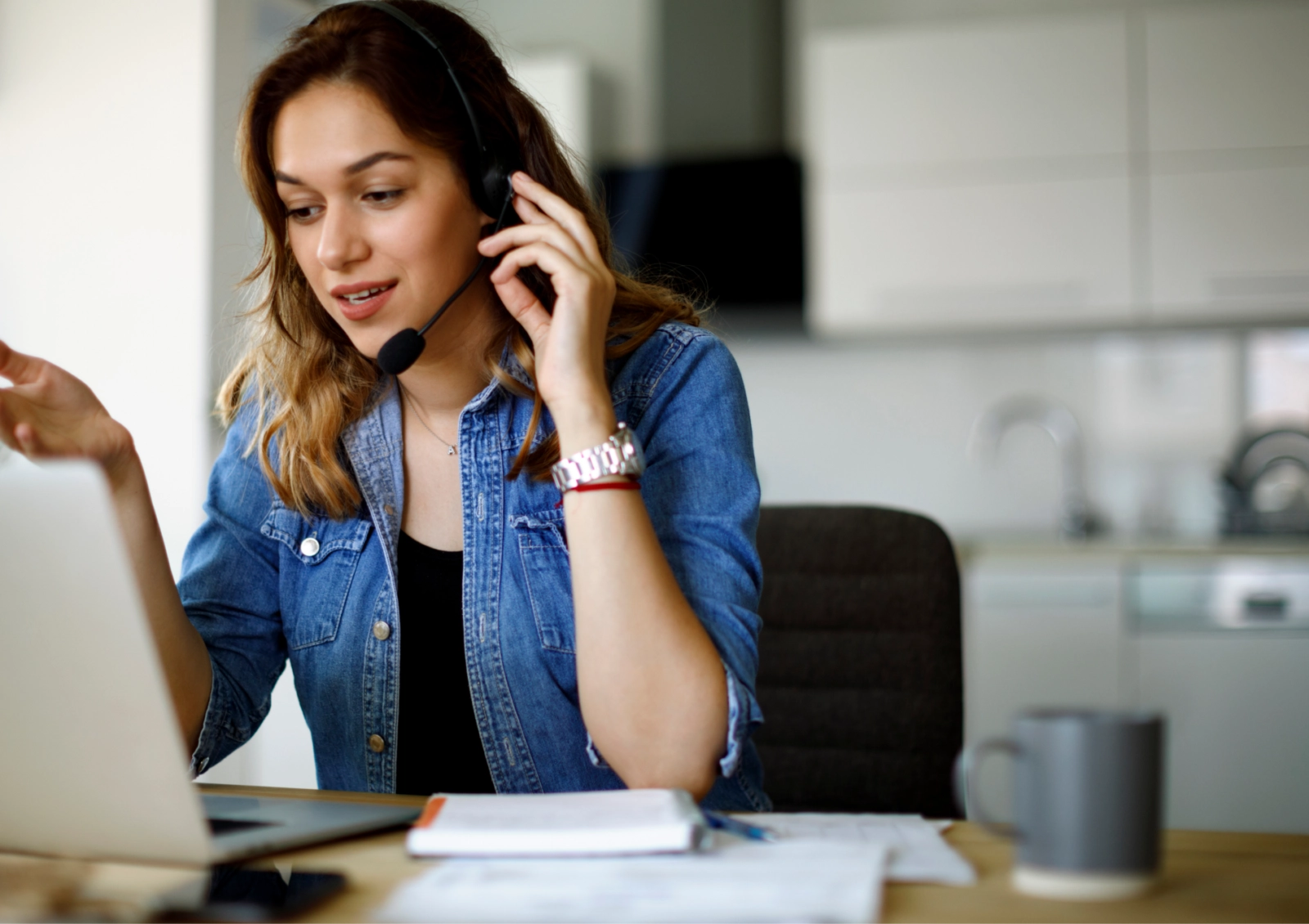 A Care Coordinator speaks with a member through a headset