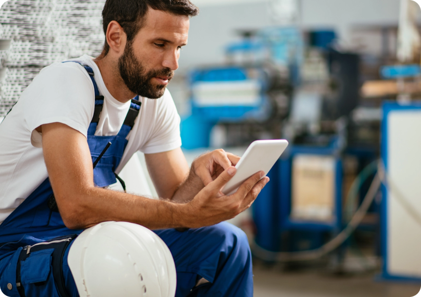 A factory worker browses available therapists from his phone