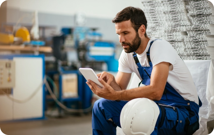 A factory worker browses available therapists from his phone