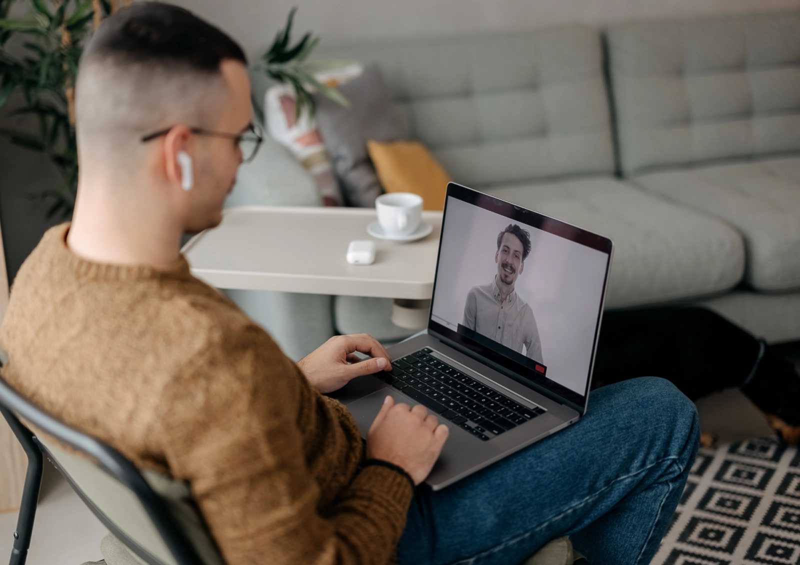 Man on virtual therapy call.