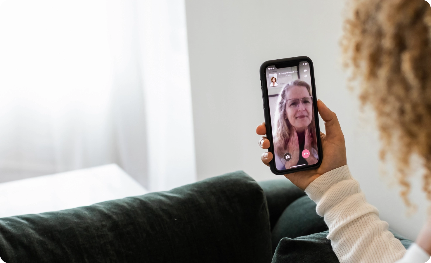 A doctor virtually treats a patient who is having throat pain