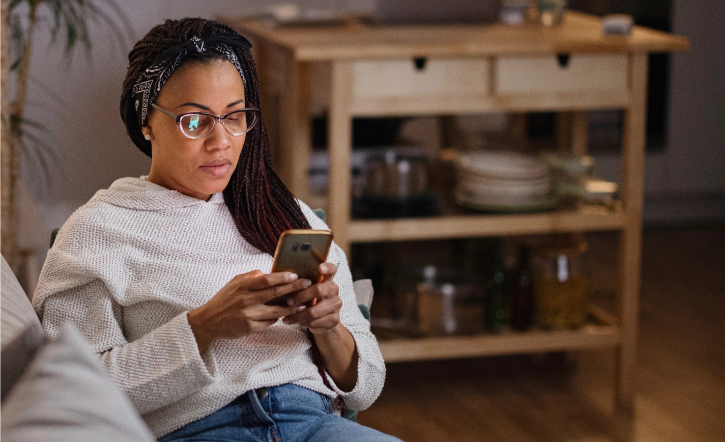 woman on phone on couch
