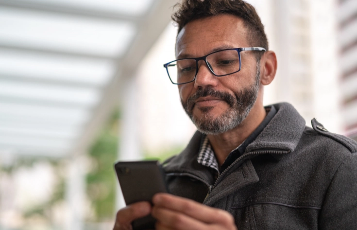 man looking at cell phone