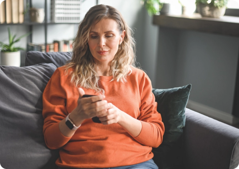 woman looking at cell phone