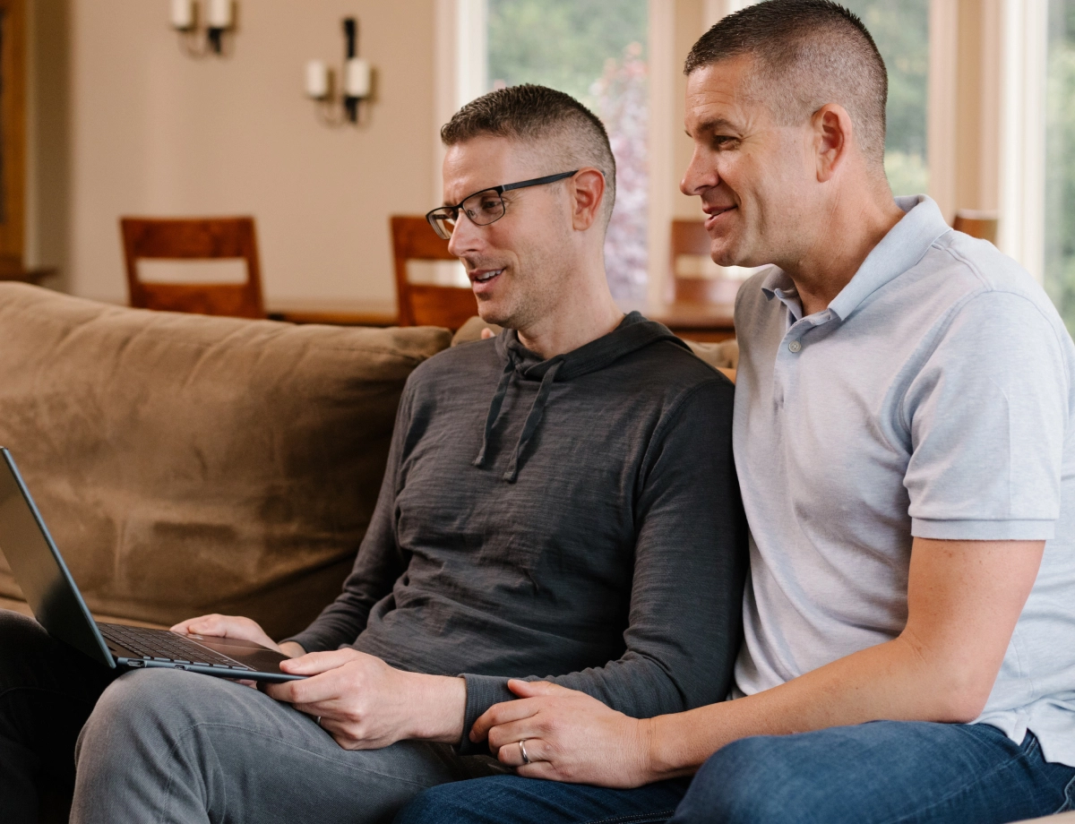 Two men on laptop