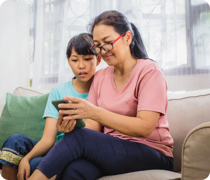Mom with her child adding him as a dependent to the Included Health app