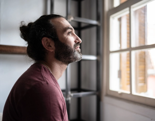 Man staring out of the window