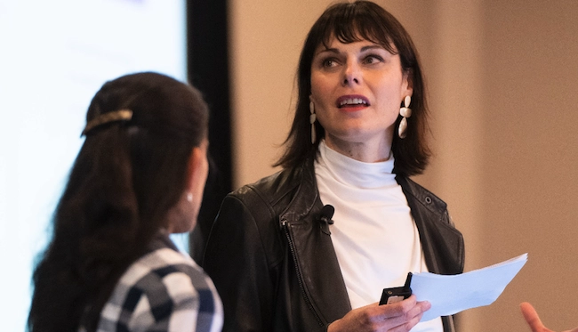 Included Health employees speaking at a conference