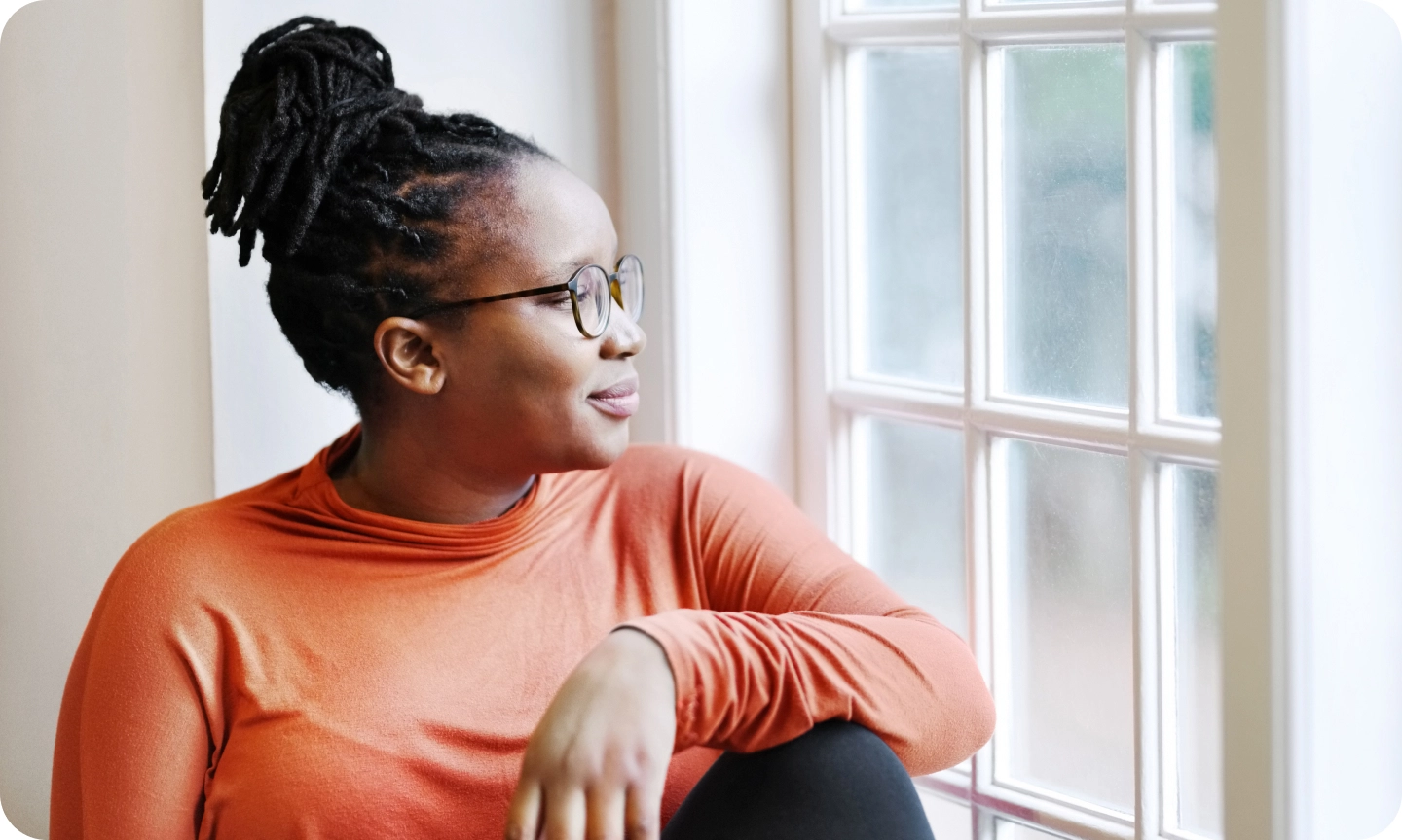 woman looking out window