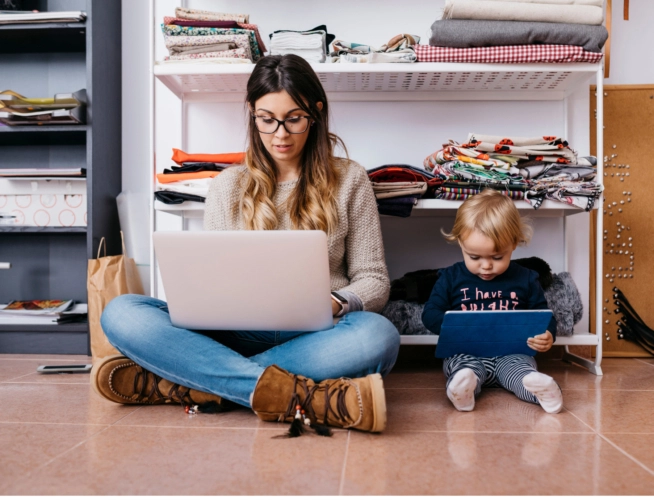 Girl on floor using laptop for healthcare navigation