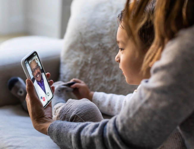 mother and child in telemedicine call