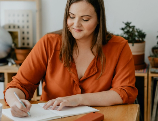 Woman writing on paper