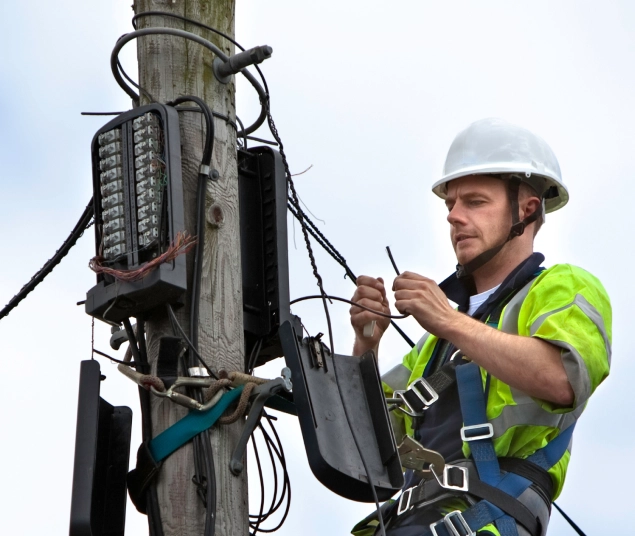man working on telephone pole