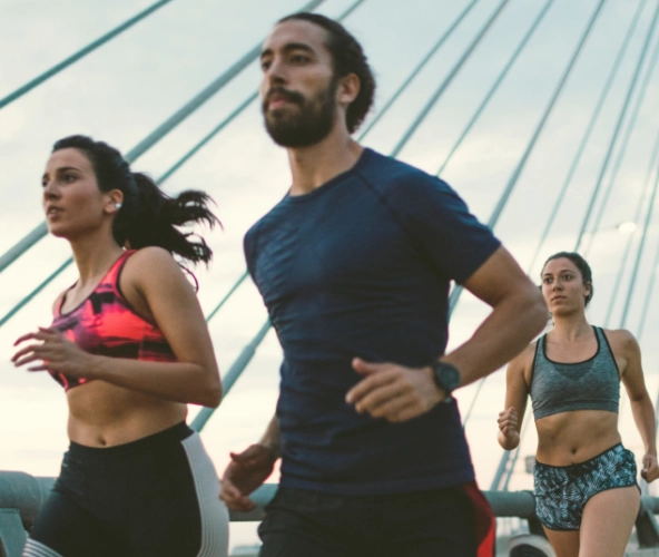 three people running together