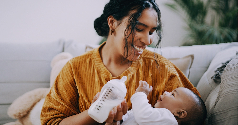 Mom feeding baby with bottle