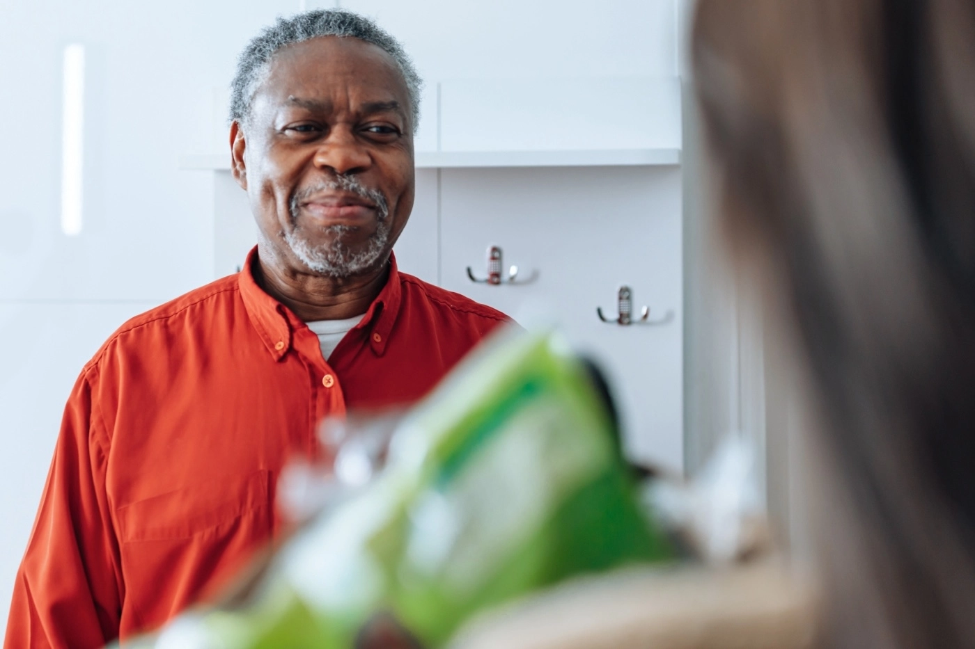 man smiling at woman looking at him