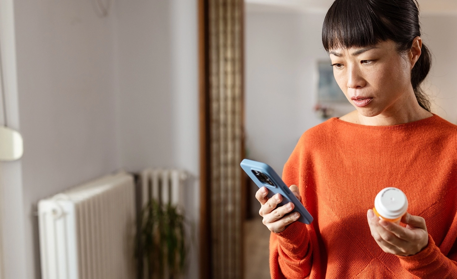 woman looking at her prescription