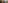 Woman holding hands over her head smiling