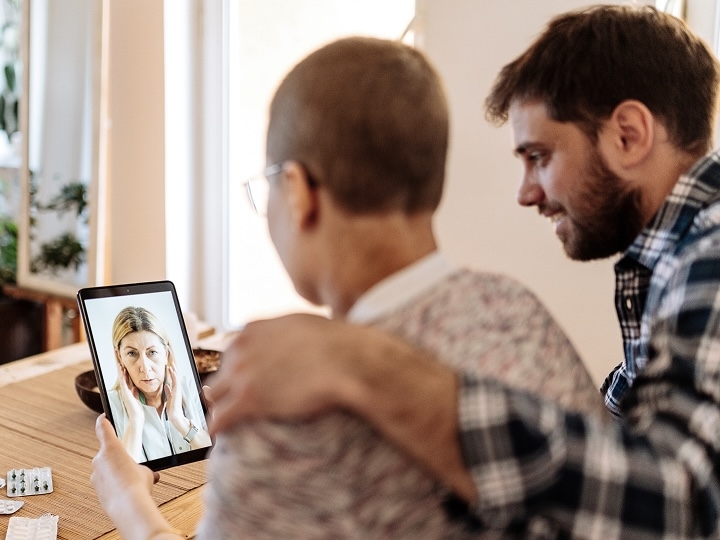 Man with arm around a loved one with cancer.