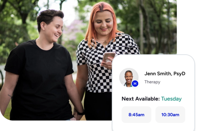 Photo of lgbtq+ couple walking and smiling.