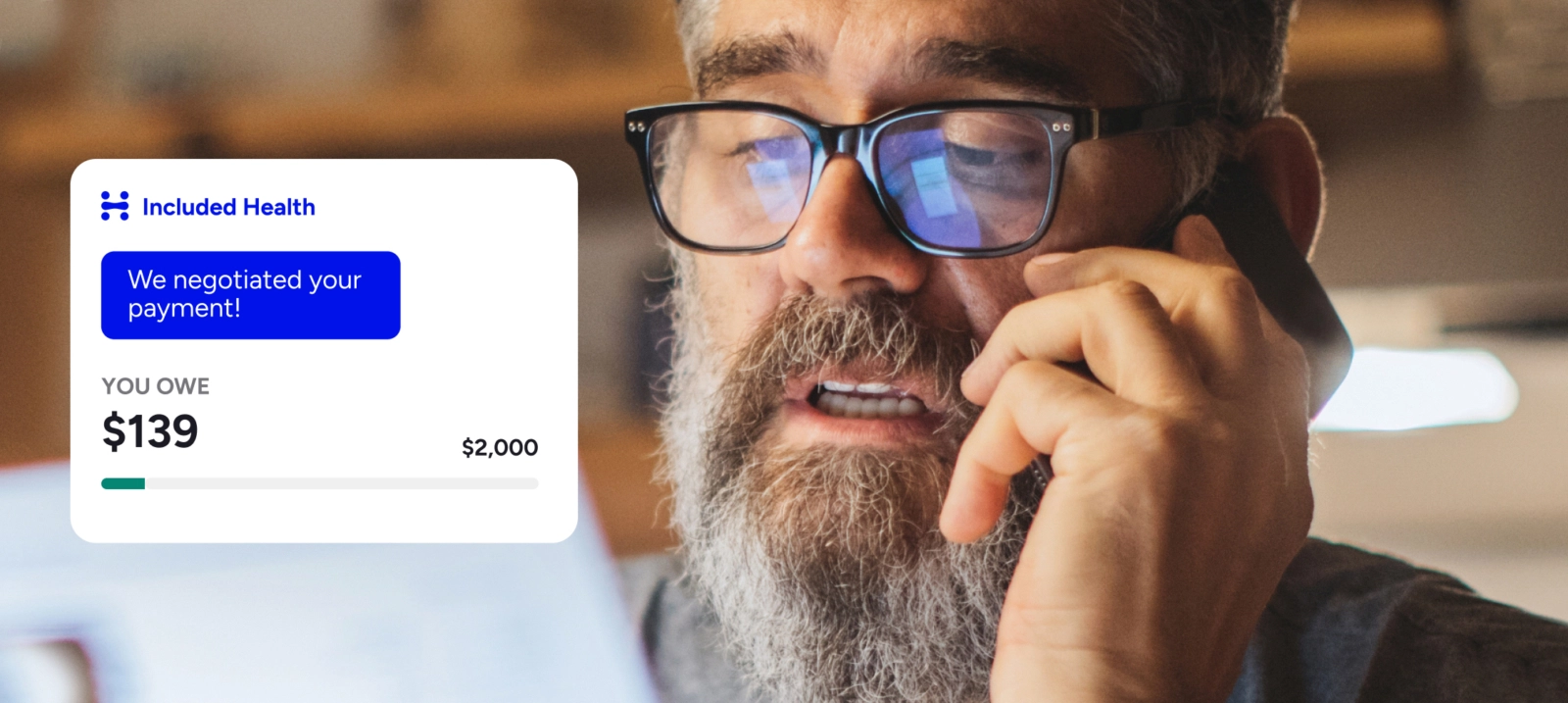 Man with glasses in phone call. Text says We negotiated your payment!