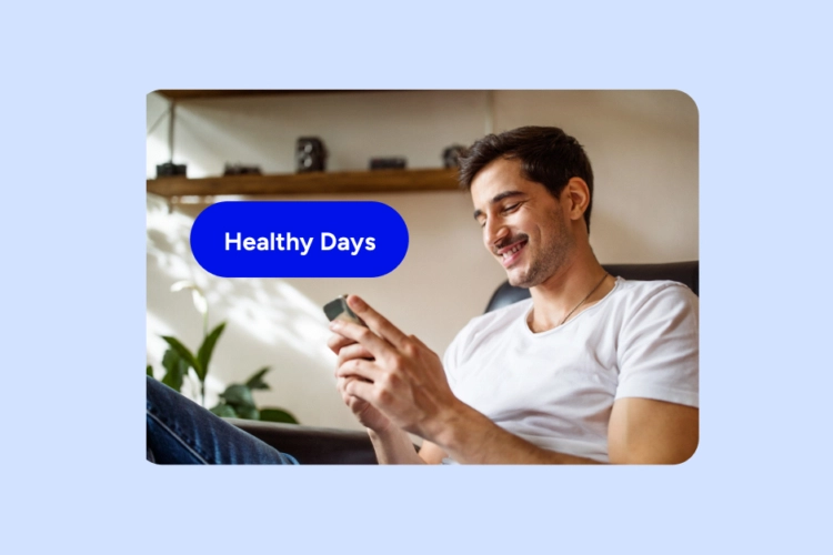 Word Healthy Days and man with smartphone