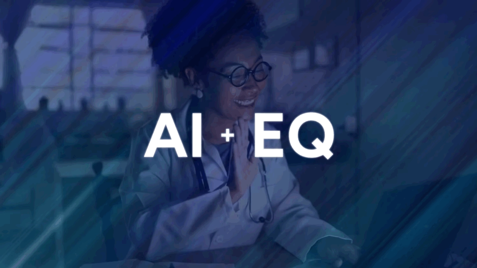 Woman behind computer waving. Large letters AI EQ overlaying the image