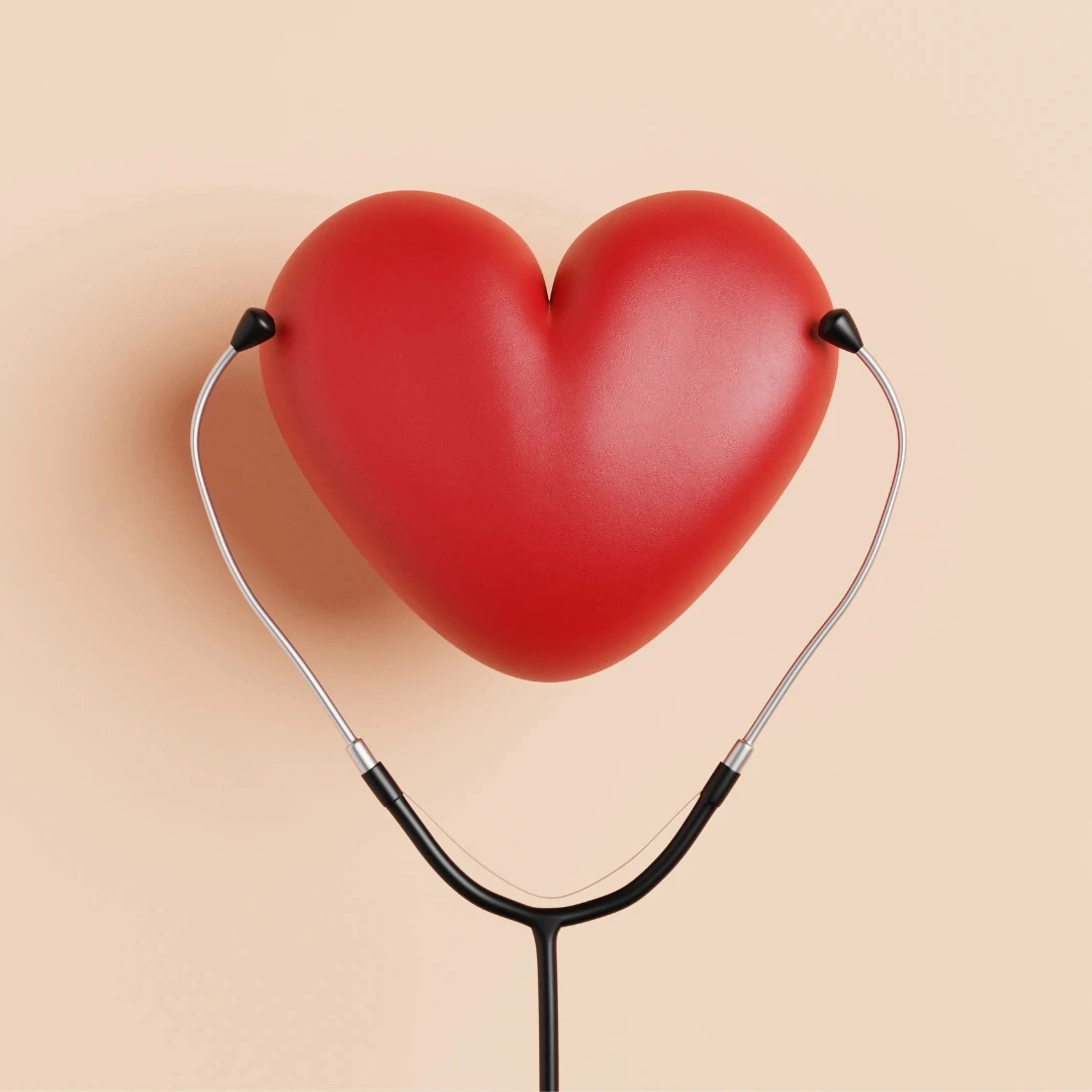 A close-up, rendered image of a large, smooth red heart, with the earpieces of a black stethoscope resting against it. The image symbolizes heart health and medical diagnosis.