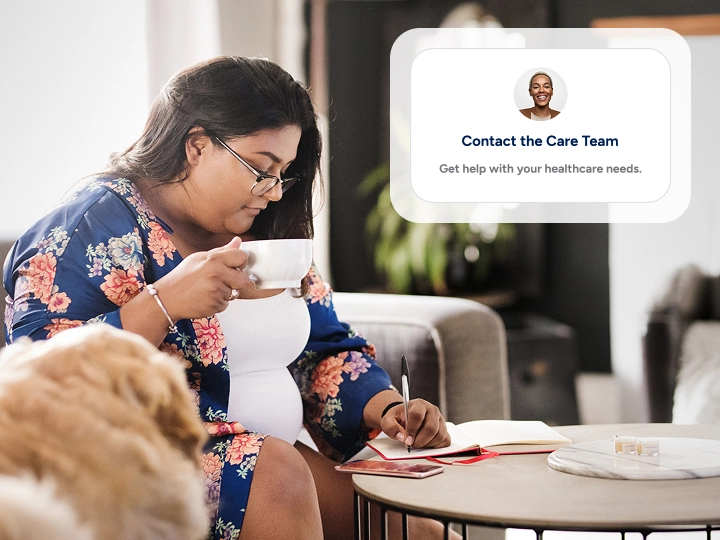 Pregnant woman having tea and making notes about her care plan next to a UI element focusing on the care team.