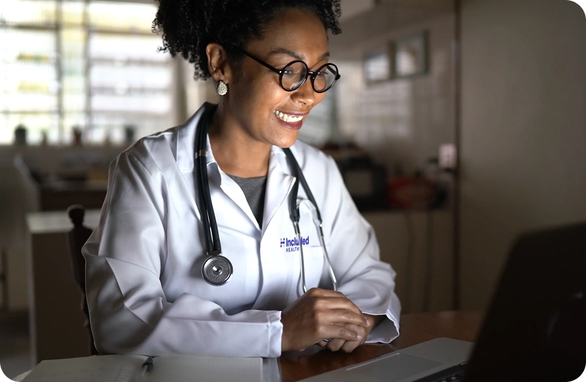 Included Health doctor using computer for patient visit
