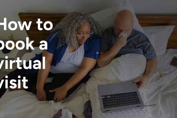 A couple in bed booking a telehealth visit
