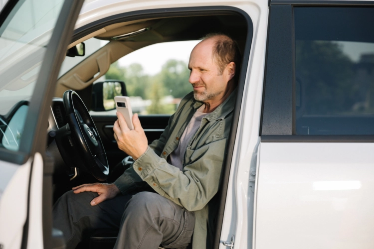 Man in truck with phone