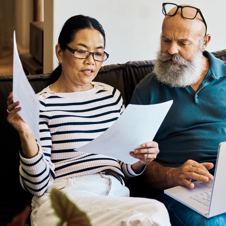 couple looking at medical paperwork